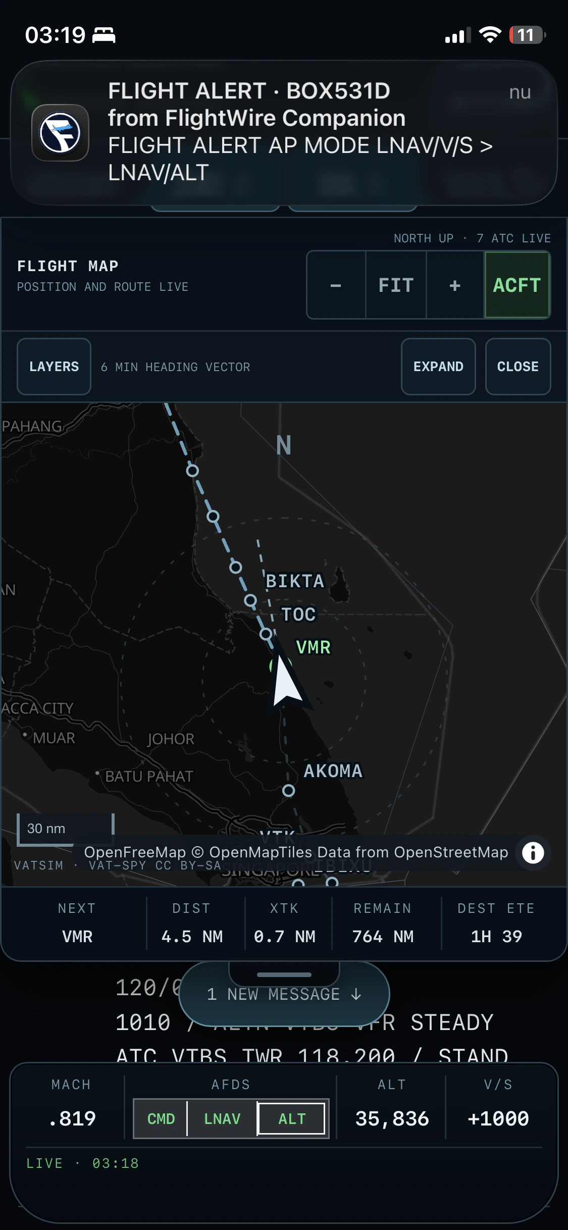 FlightWire Companion on iPhone showing a live route, aircraft status and flight alert